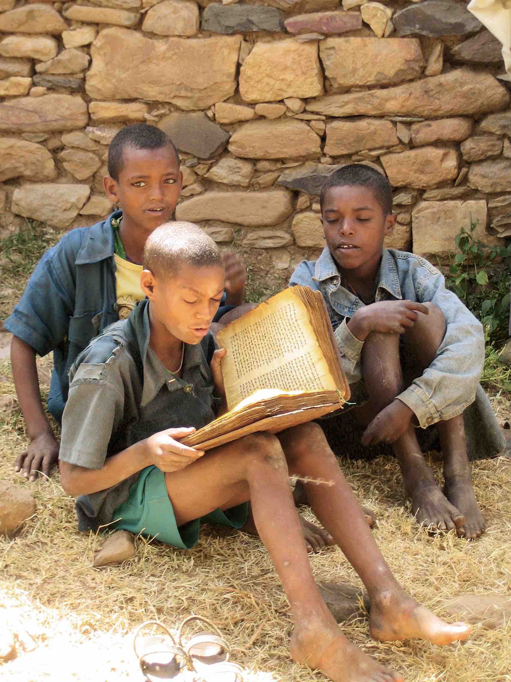 Ethiopian boys reading a Geʻez manuscript, Yeha, Tigray Province